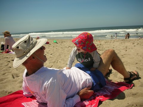 George Wolfberg with grandson at Will Rogers State Beach.